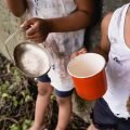 cropped-view-of-homeless-african-american-kids-holding-cup-and-metal-plate-while-begging-alms-on.jpg